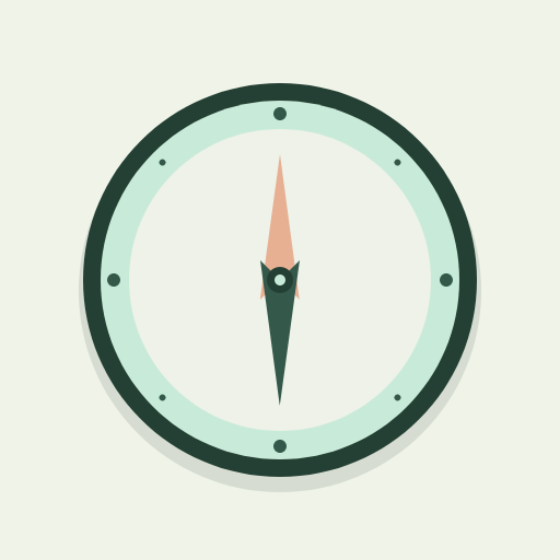 An original mint compass with a peach north pointer and a forest-green dial